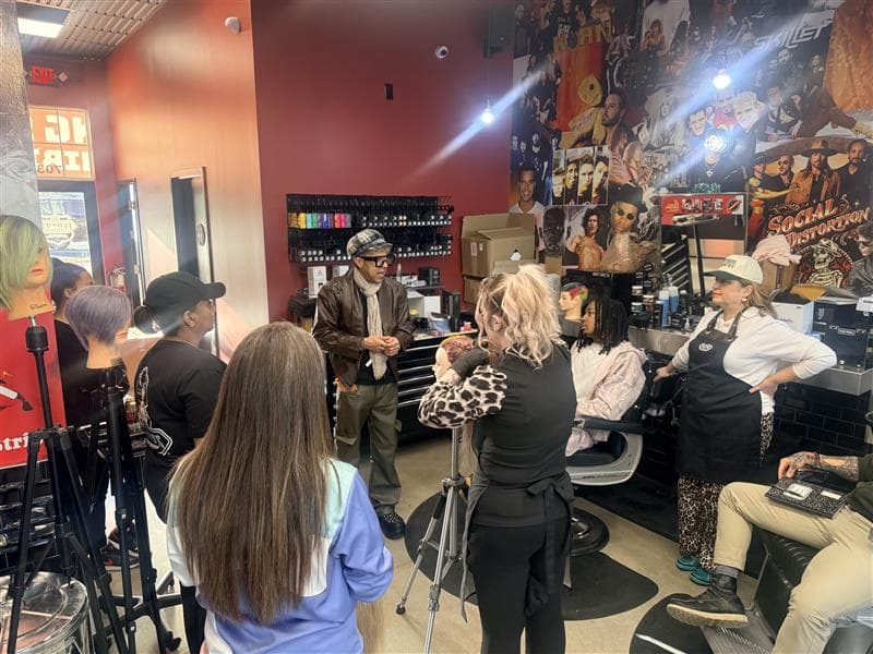 Floyd's Barbershop team members receiving technical education on the latest trends and techniques in barbering.