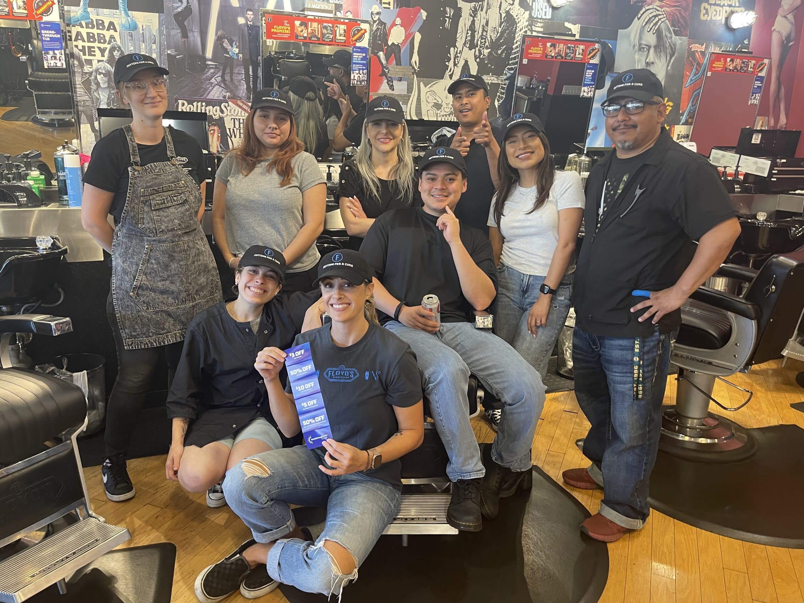 Floyds Barbershop team of barbers and stylists smiling for "Cutting for a Cause" supporting the type 1 diabetes community