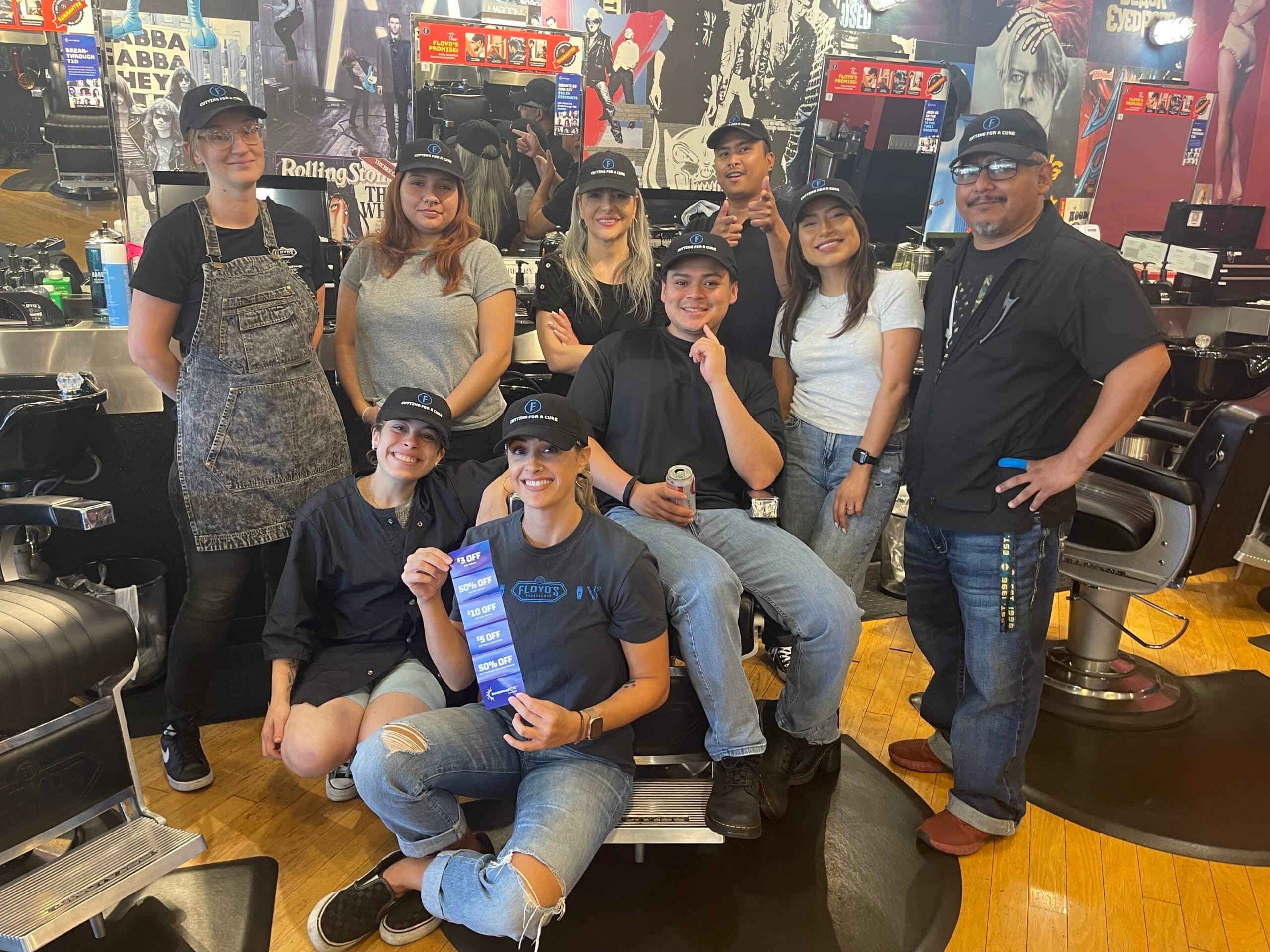 Floyds Barbershop team of barbers and stylists smiling for "Cutting for a Cause" supporting the type 1 diabetes community